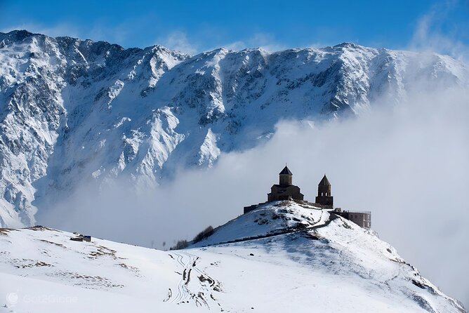From Tbilisi Daytrip Kazbegi Gudauri & Zhinvali Guided Group Tour - Reaching Gergeti Trinity Church by 4x4