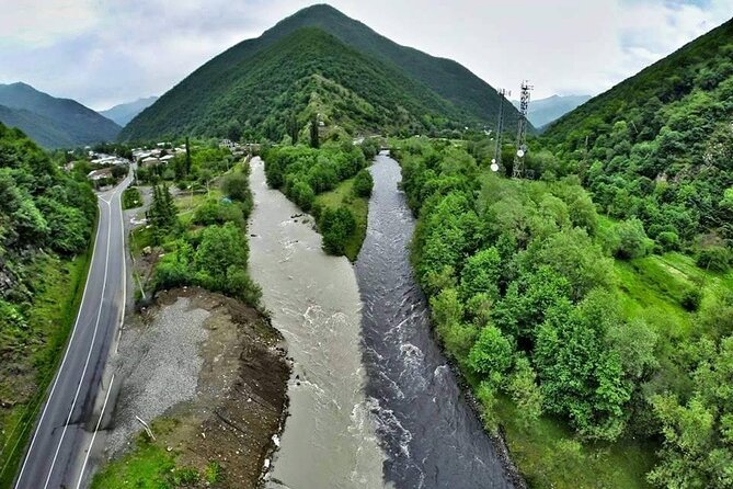 From Tbilisi: Kazbegi Day Tour, Gergeti Trinity, Ananuri &Gudauri - Zhinvali Reservoir, water over an older town
