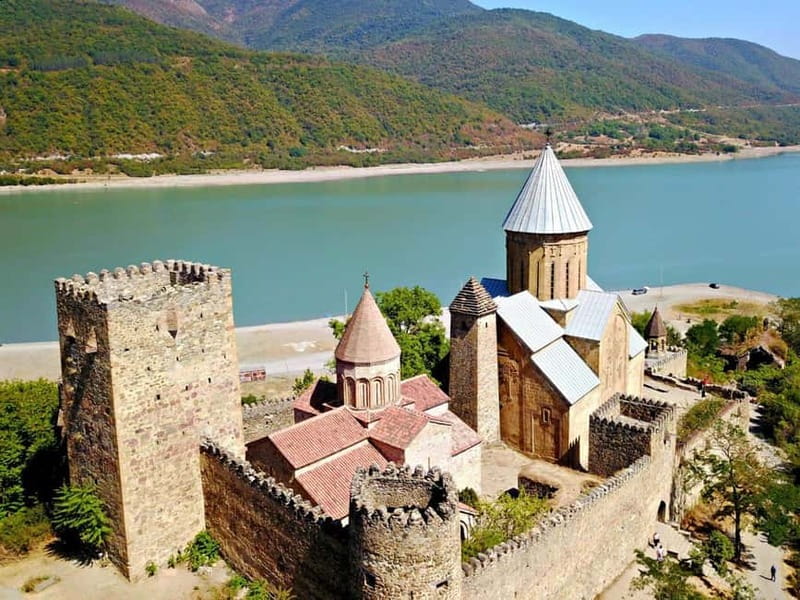 From Tbilisi: Kazbegi, Gudauri & Gergeti Group Day Tour - Ananuri Fortress above the reservoir