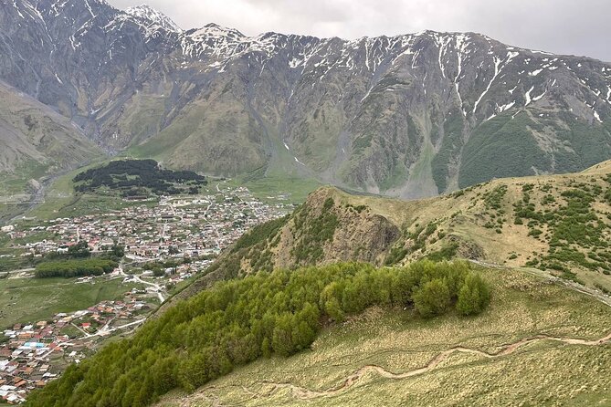 Kazbegi.All inclusive tour in Caucasus mountains - The Friendship Arch: striking, political, and easy to dismiss