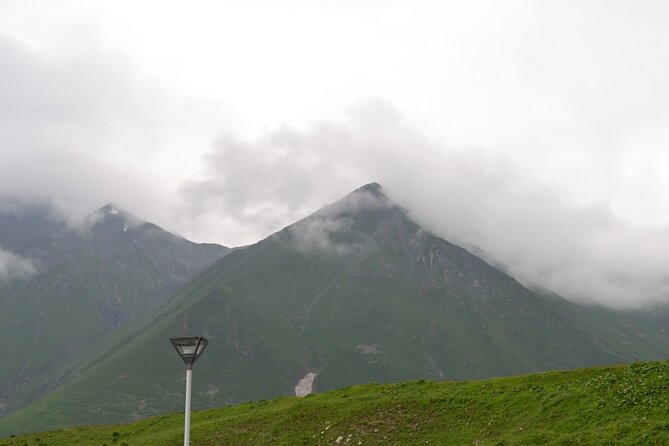 KAZBEGI GUDAURI ANANURI One day group tour From Tbilisi! - Stepantsminda, the gateway below Kazbegi