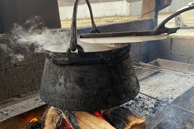 Khinkali Birthplace Gastronomy Tour in Pshavi - Watching khinkali cook over the fire
