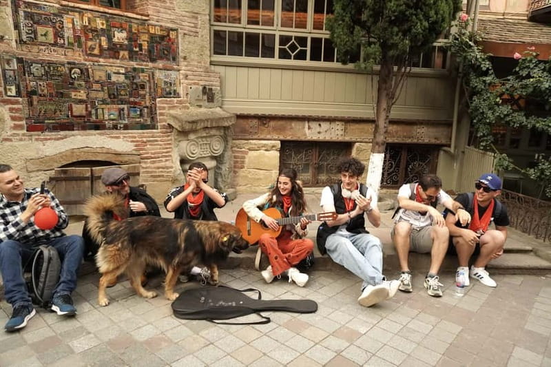 Tbilisi: Evening Walking Tour with Wine & Boat Ride Options - Key points at a glance