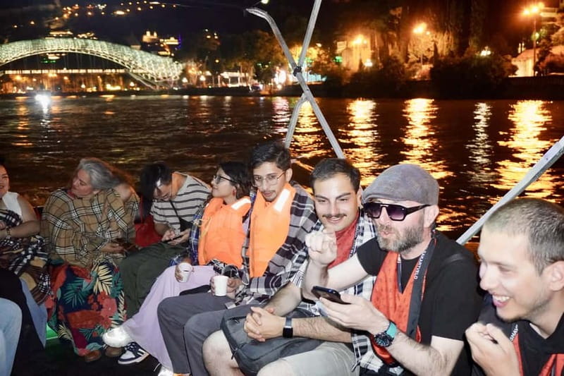 Tbilisi: Evening Walking Tour with Wine & Boat Ride Options - The clock tower and Rezo Gabriadze’s curious world