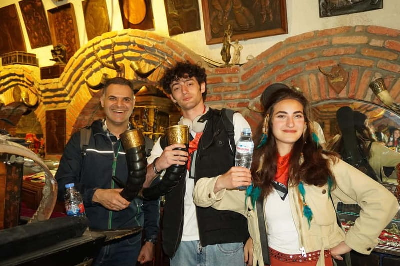 Tbilisi: Evening Walking Tour with Wine & Boat Ride Options - The bathhouse area and the illuminated waterfall