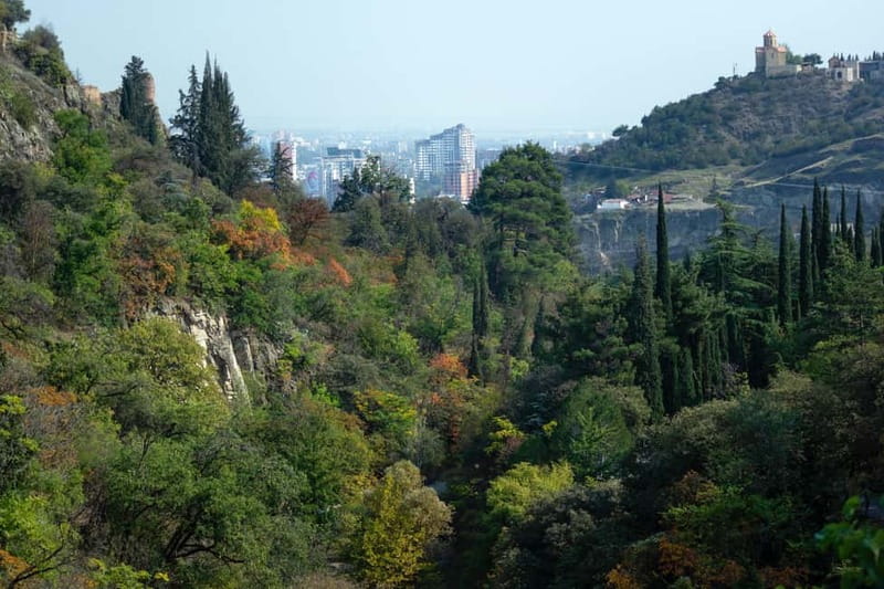 Tbilisi: Guided Walking Tour, Must See & Taste (All-Incl.) - Crossing the Bridge of Peace and riding above the city